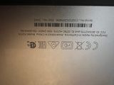 the back of a laptop with a bar code on it