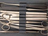 a bunch of surgical instruments in a black case