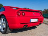 a red sports car parked on the side of the road