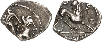 a close up of a coin with a bird on it
