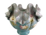 a blue vase with flowers on it on a white background