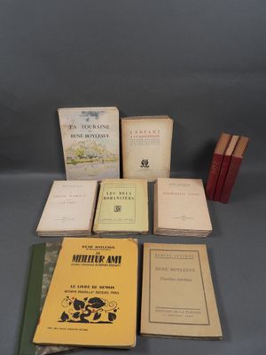 several books are sitting on top of a table next to each other