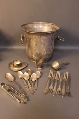 a lot of silver spoons and spoons on the table
