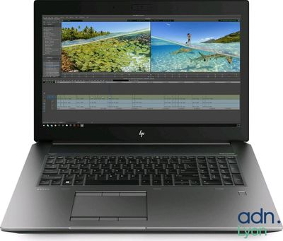 a laptop with a picture of a beach on the screen