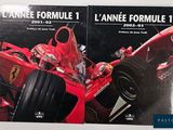 two books on a white surface with a red racing car in the background