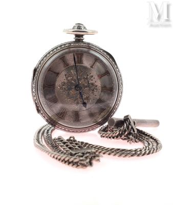 a silver pocket watch with a chain on a white background