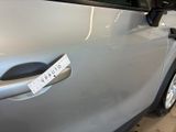 a sticker on the door of a car with a sticker on it