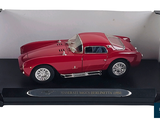 a red model of a car in a display case