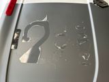 a sticker on the back of a car that has a picture of a swan on it