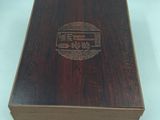 a wooden box that has a design on it