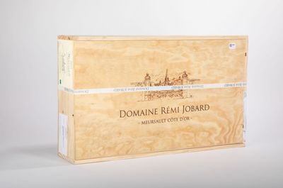 the wooden box is holding a bottle of wine and a bottle of wine