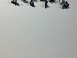 a lot of figurines of people riding horses in the snow