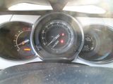 a close up of a car dashboard with various gauges