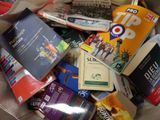 a bag full of books and magazines on the floor