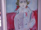 un tableau représentant une femme assise sur un canapé rouge