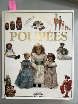 a book with a picture of dolls on the cover