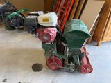 a small machine that is sitting in a garage