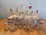 a lot of glasses sitting on a wooden table