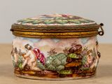 a small box with a painting on it sitting on a table