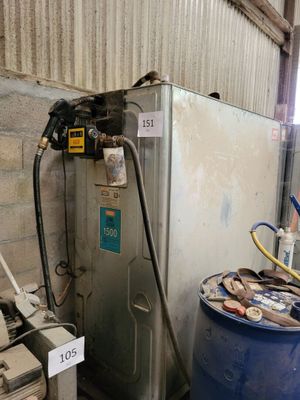 a blue barrel with a hose next to a water heater and a blue barrel with a hose next to a blue barrel with a water heater