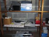a shelf that has a bunch of items on top of it