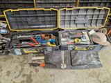 many tools in a tool box on the floor