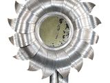 a metal sunflower shaped object on a white background