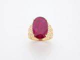 an oval ruby and diamond ring