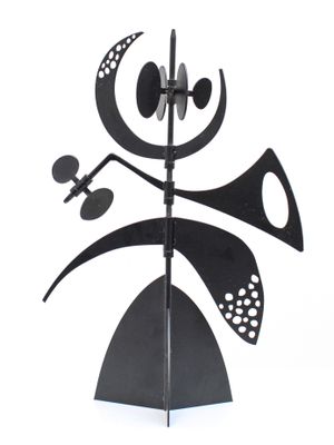 a black and white photo of a sculpture of a man