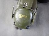 a green motorcycle with a helmet on the back of it