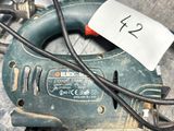 an image of a corded jig saw sitting in a box