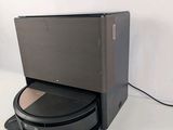 a black box that is sitting on top of a toilet