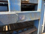 a close up of a blue truck with a sign on it