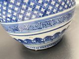 a blue and white bowl sitting on a table