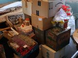 many boxes stacked on top of each other in a room