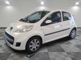 a picture of a small white car on a checkered floor