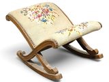a rocking chair with a floral design on it
