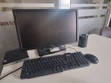 a desk with a keyboard and a monitor on it