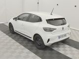 the rear end of a white car parked in a garage