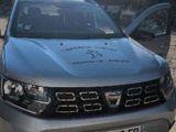 a silver pick up truck parked in a parking lot