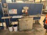an image of a machine that is working on a piece of metal
