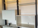 a white bookcase with two drawers in a room
