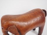 leather elephant foot stool with tusks and tusks in the shape of an elephant