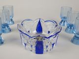 six glasses and a bowl on the table