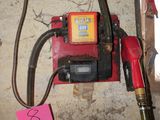 a picture of a gas pump and a hose in a room