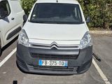 a white van parked next to a white van in a parking lot