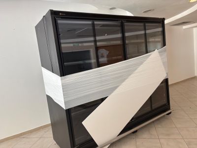 a refrigerator that has been wrapped up in a room