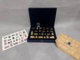 an open box of stamps and a card on a table