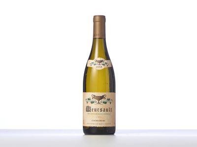 a bottle of white wine sitting on top of a table