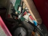 a red box filled with assorted items on the floor